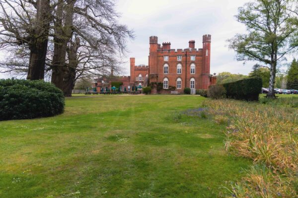 An area of lawn space at the side of the Cumberland Lodge building