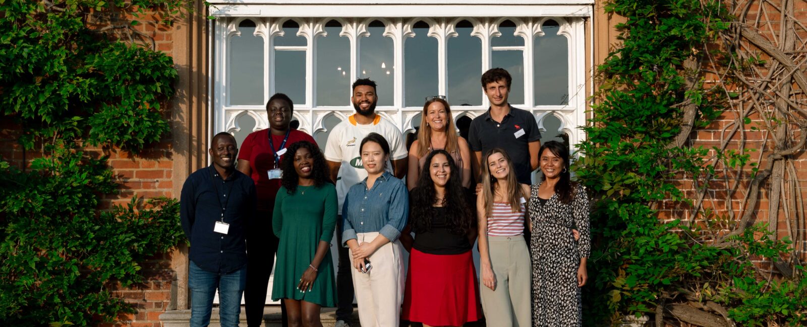 Our 10 new Cumberland Lodge Fellows standing outside the Tapestry Hall door.