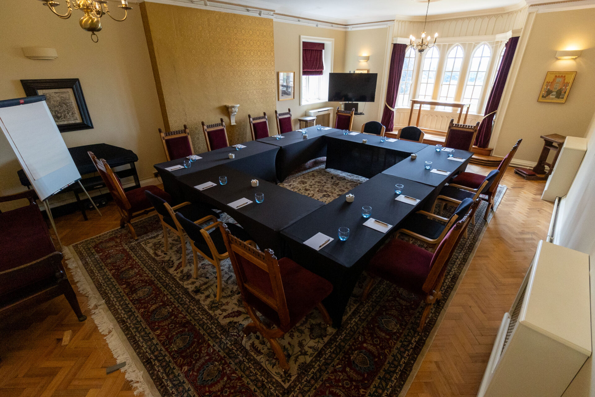 The Cumberland Lodge Chapel set up to seat 16 in a boardroom style