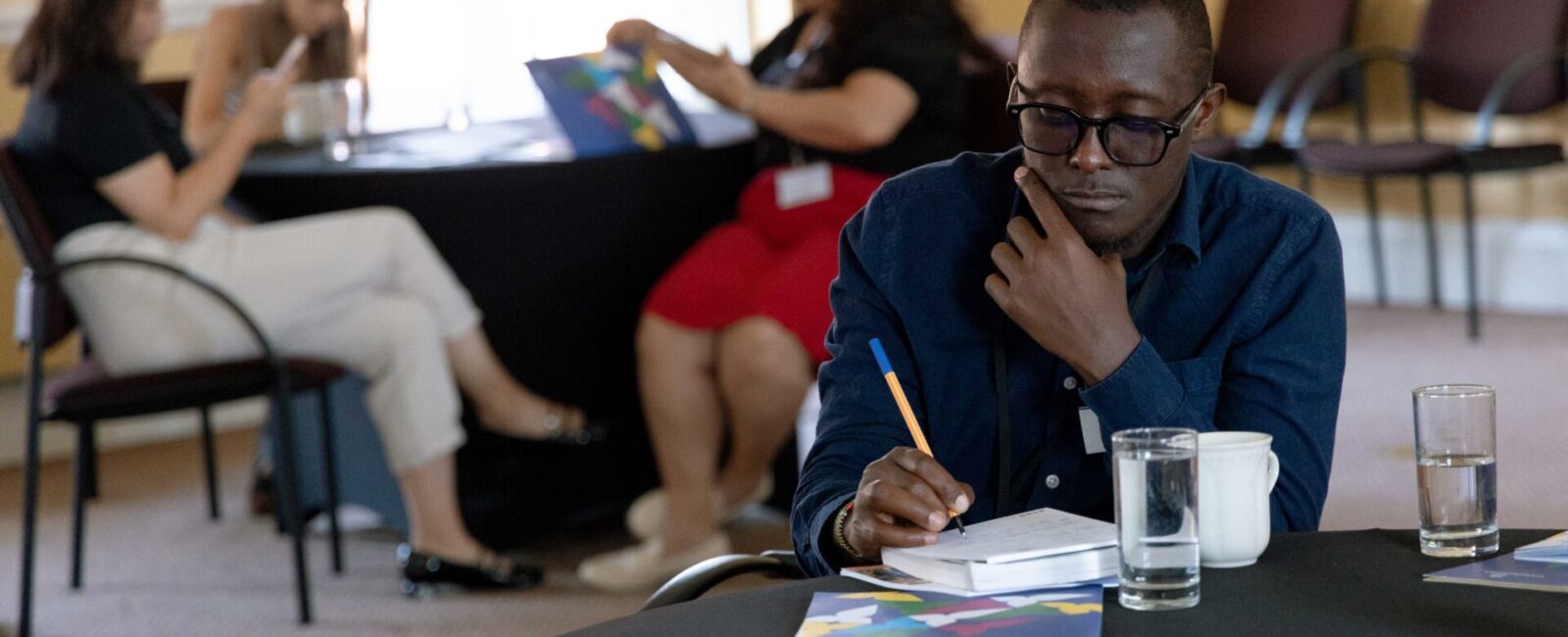 Cumberland Lodge Fellow Sam Wairimu takes notes for his future resources.