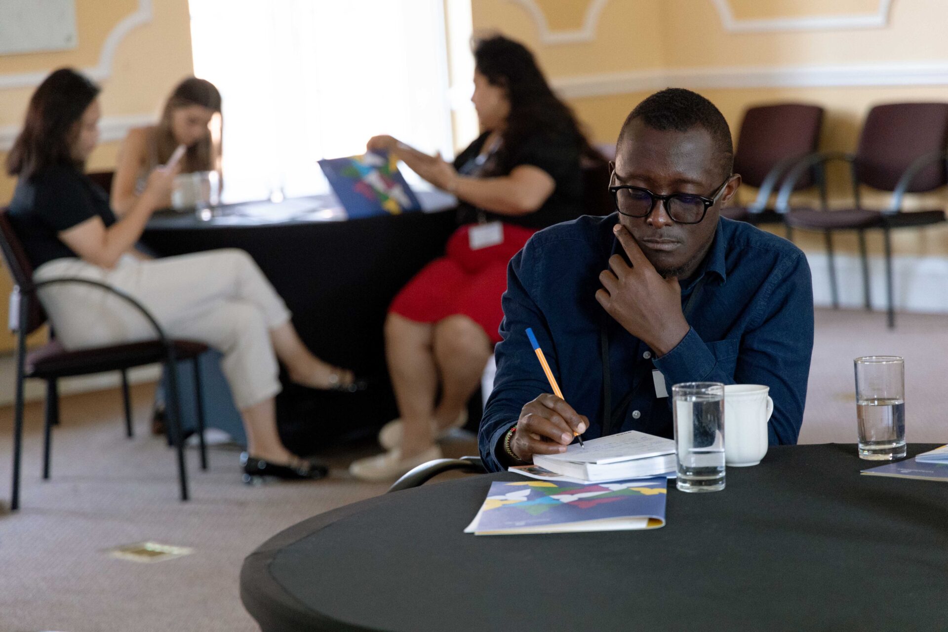 Cumberland Lodge Fellow Sam Wairimu takes notes for his future resources.