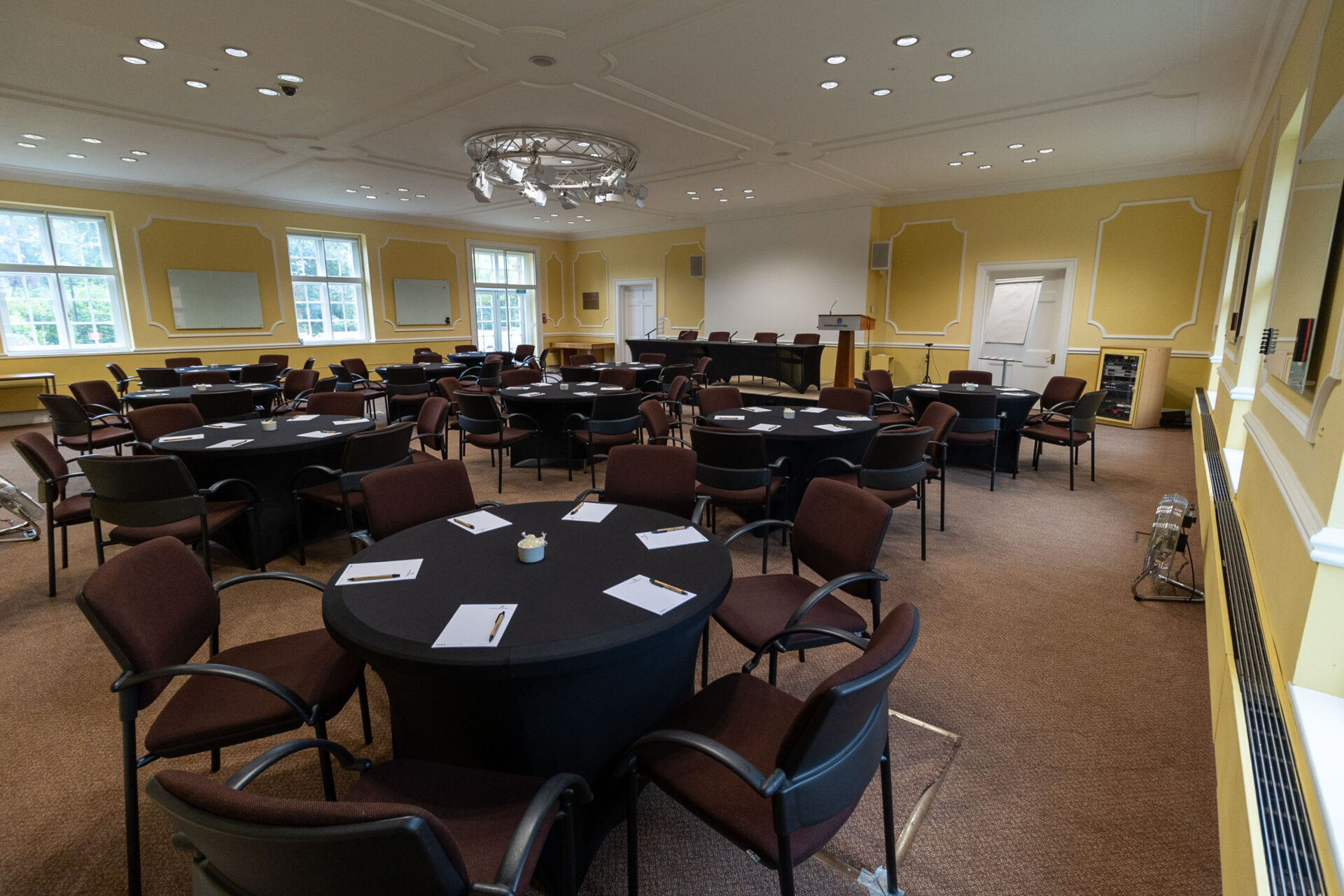 The Flitcroft conference room, set up to accommodate up to 60 people sat around circular tables.