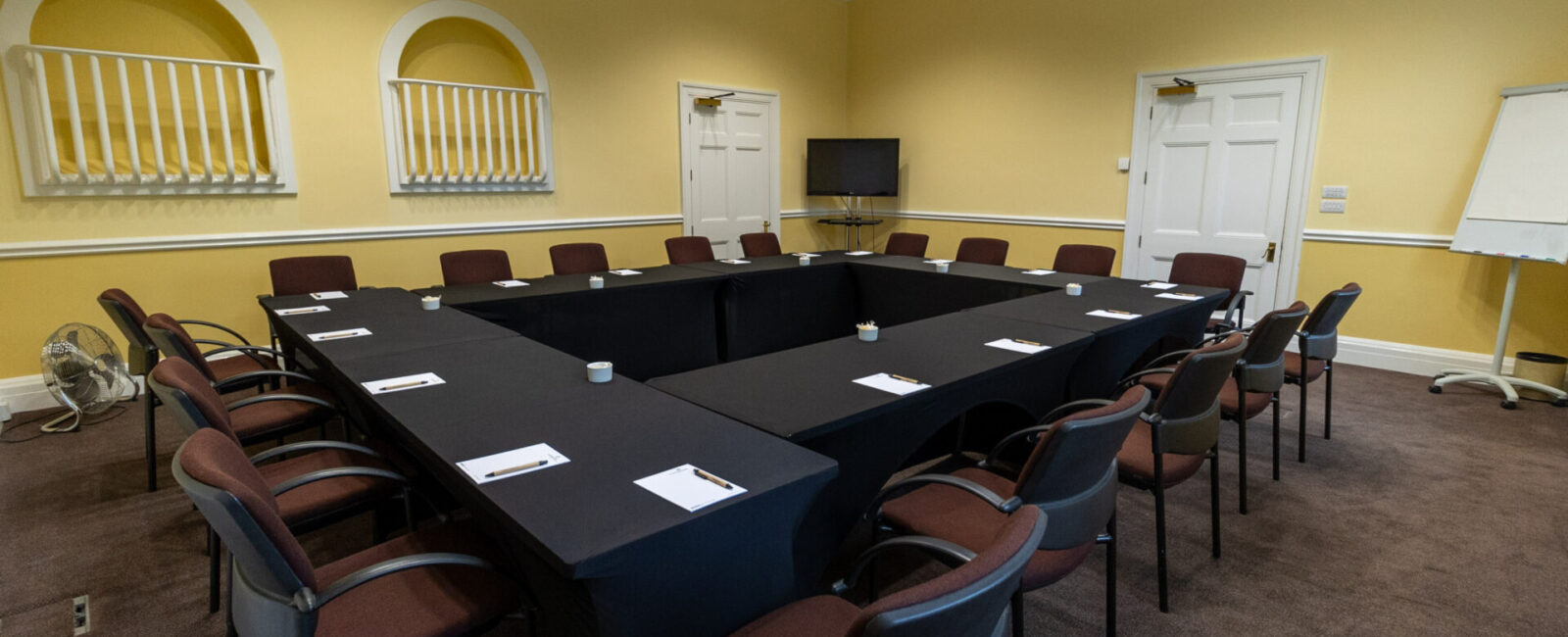 The Greening conference room, laid out in a boardroom style to accommodate up to 18 people.