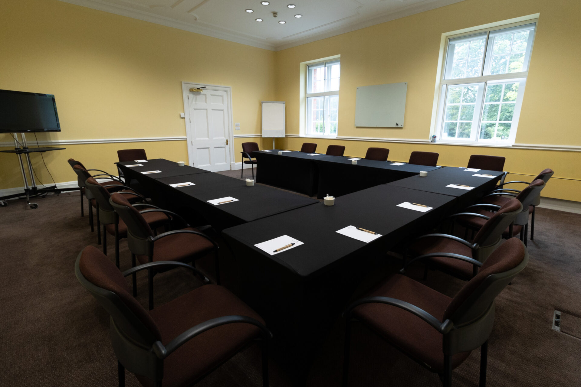 The Greening conference room, laid out in a U-shaped boardroom style to accommodate up to 16 people.