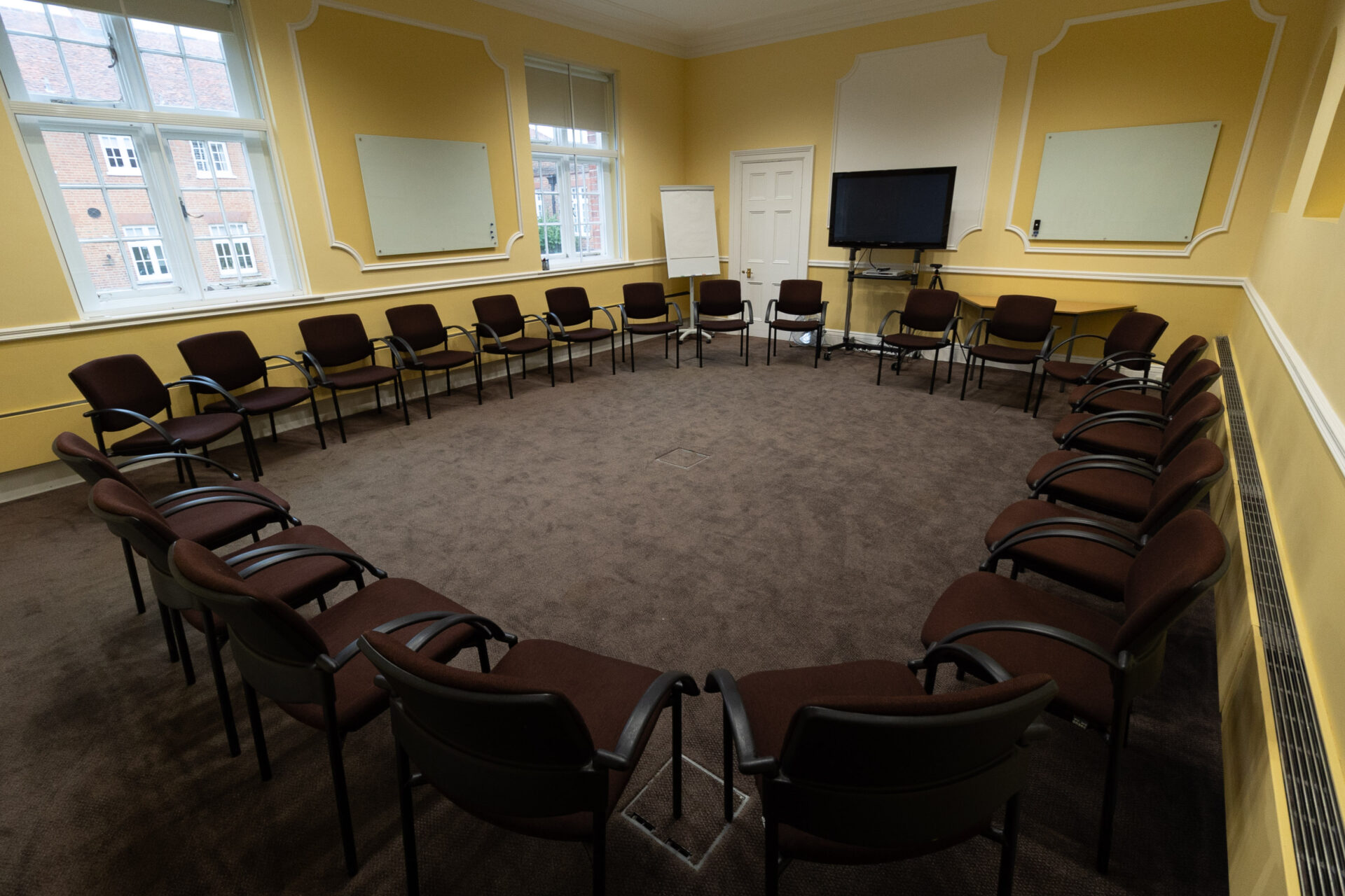 The Hodgson conference room, laid out as a circle to accommodate up to 22 people.