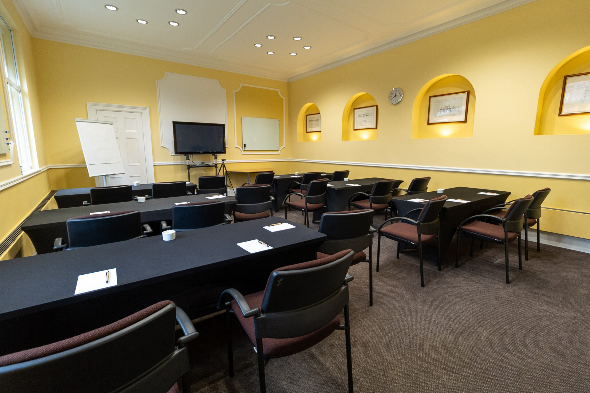 The Hodgson conference room, laid out as a classroom to accommodate up to 18 people.
