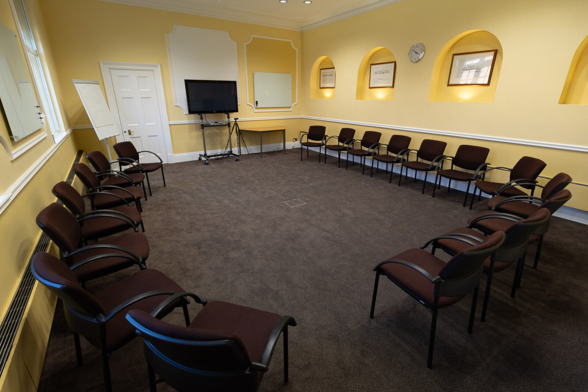 The Hodgson conference room, laid out as a U-shape circle to accommodate up to 18 people.