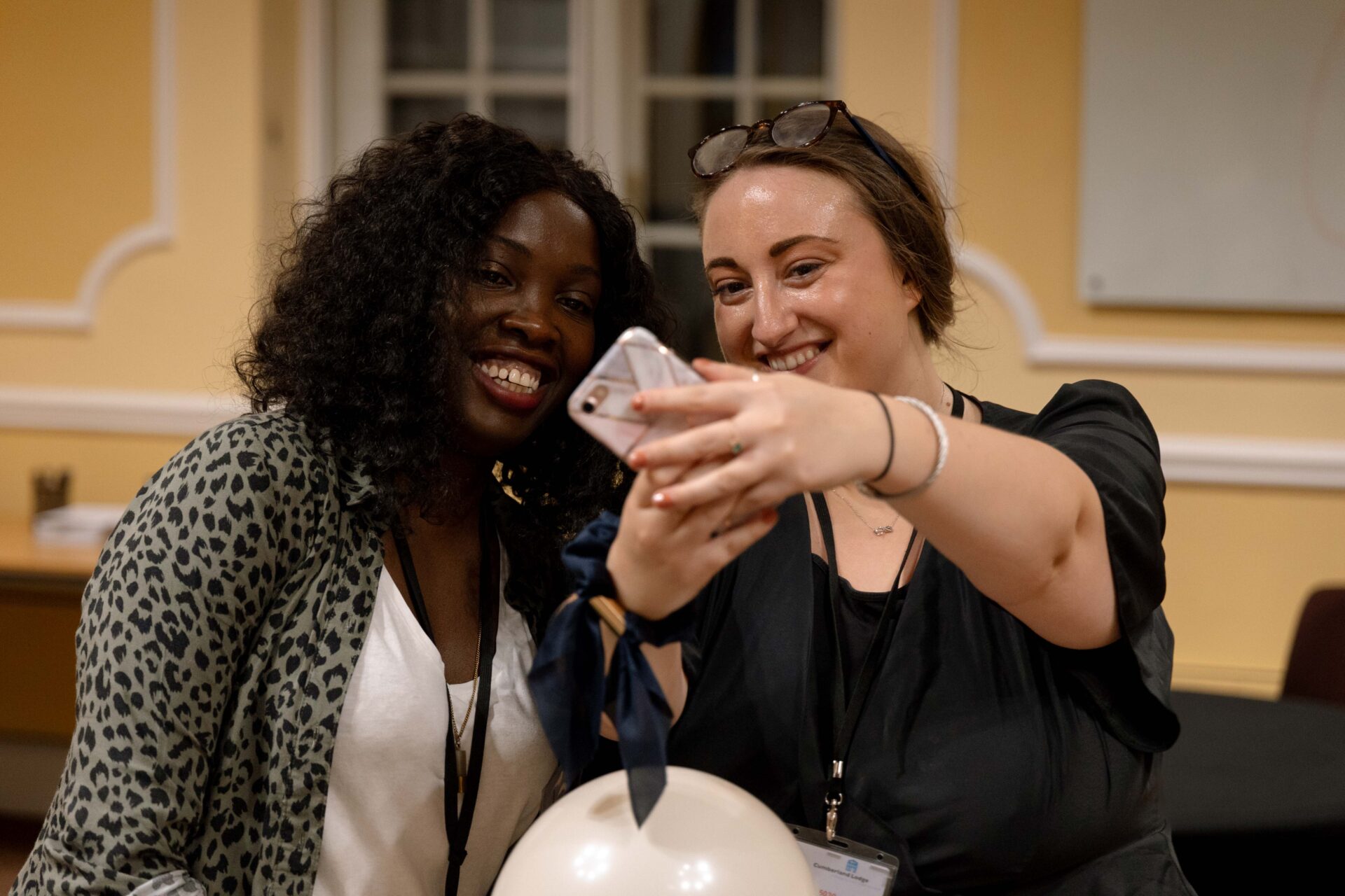 Cumberland Lodge Fellows Caroline Onyuka and Eleanor Clarke taking a selfie.