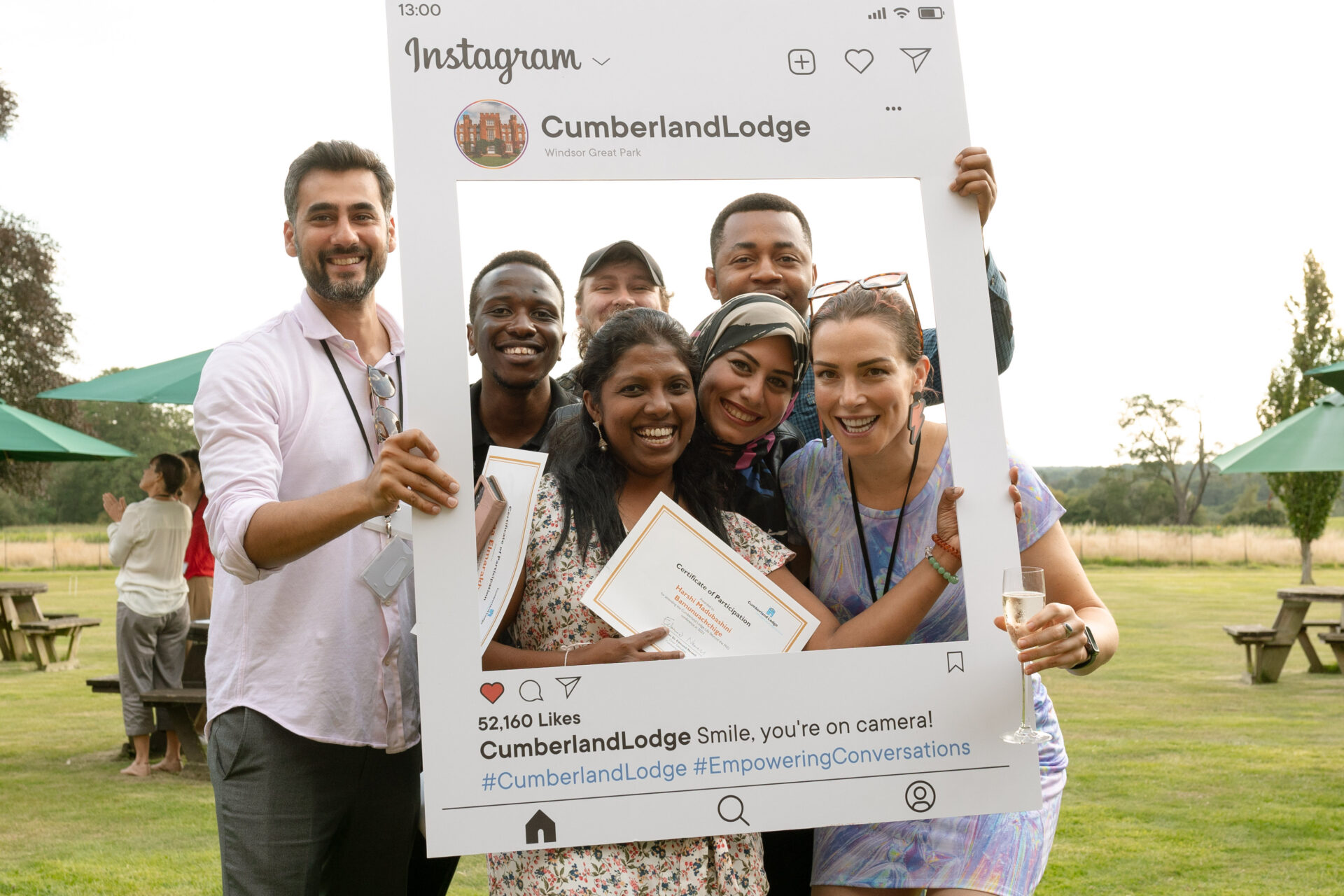 A group of students poses within a frame designed to look like an Instagram post.
