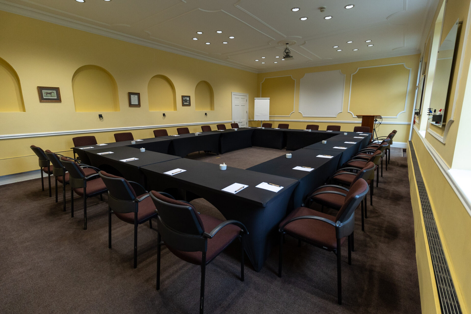 The Sandby conference room, set up in a boardroom layout to accommodate up to 24 people.
