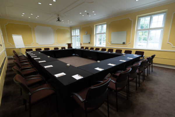 The Sandby conference room, set up in a boardroom layout to accommodate up to 30 people.