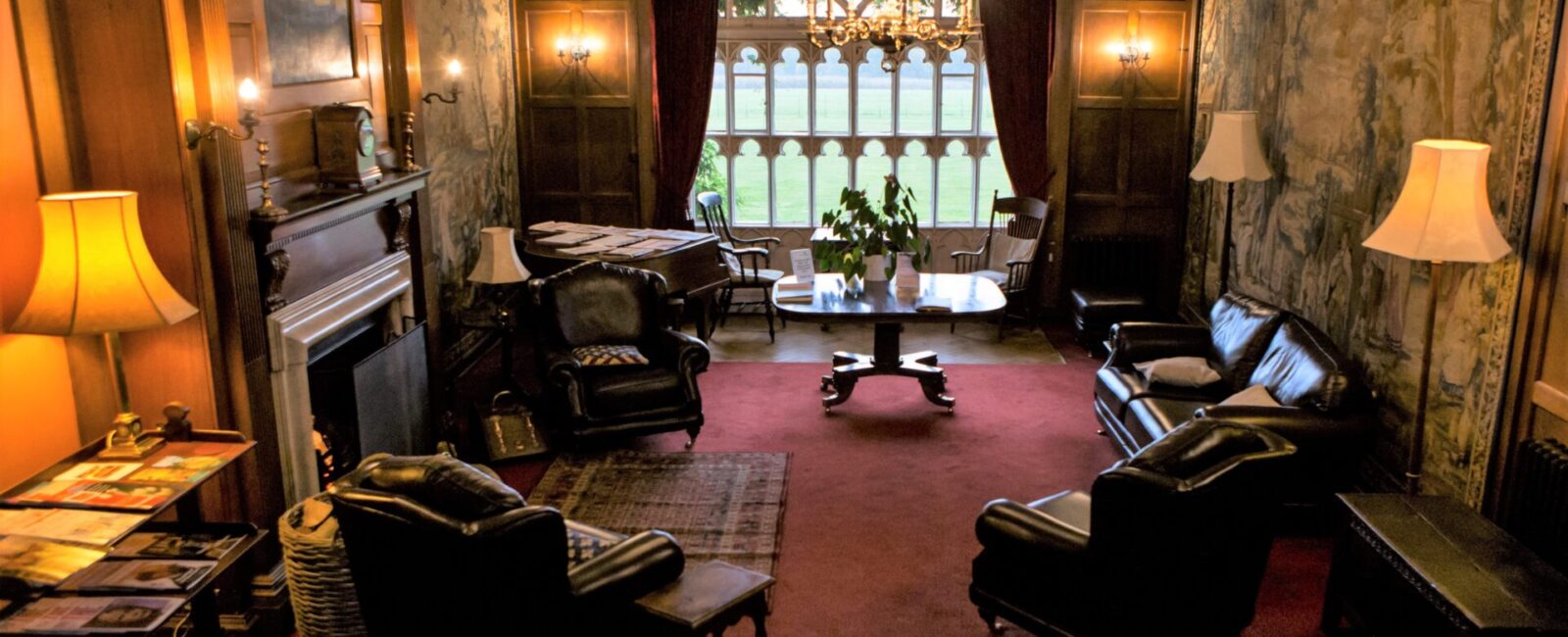 The Cumberland Lodge Tapestry Hall, featuring its iconic doors out to the Cumberland Lodge garden.