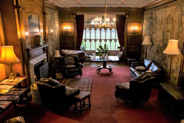 The Cumberland Lodge Tapestry Hall, featuring its iconic doors out to the Cumberland Lodge garden.