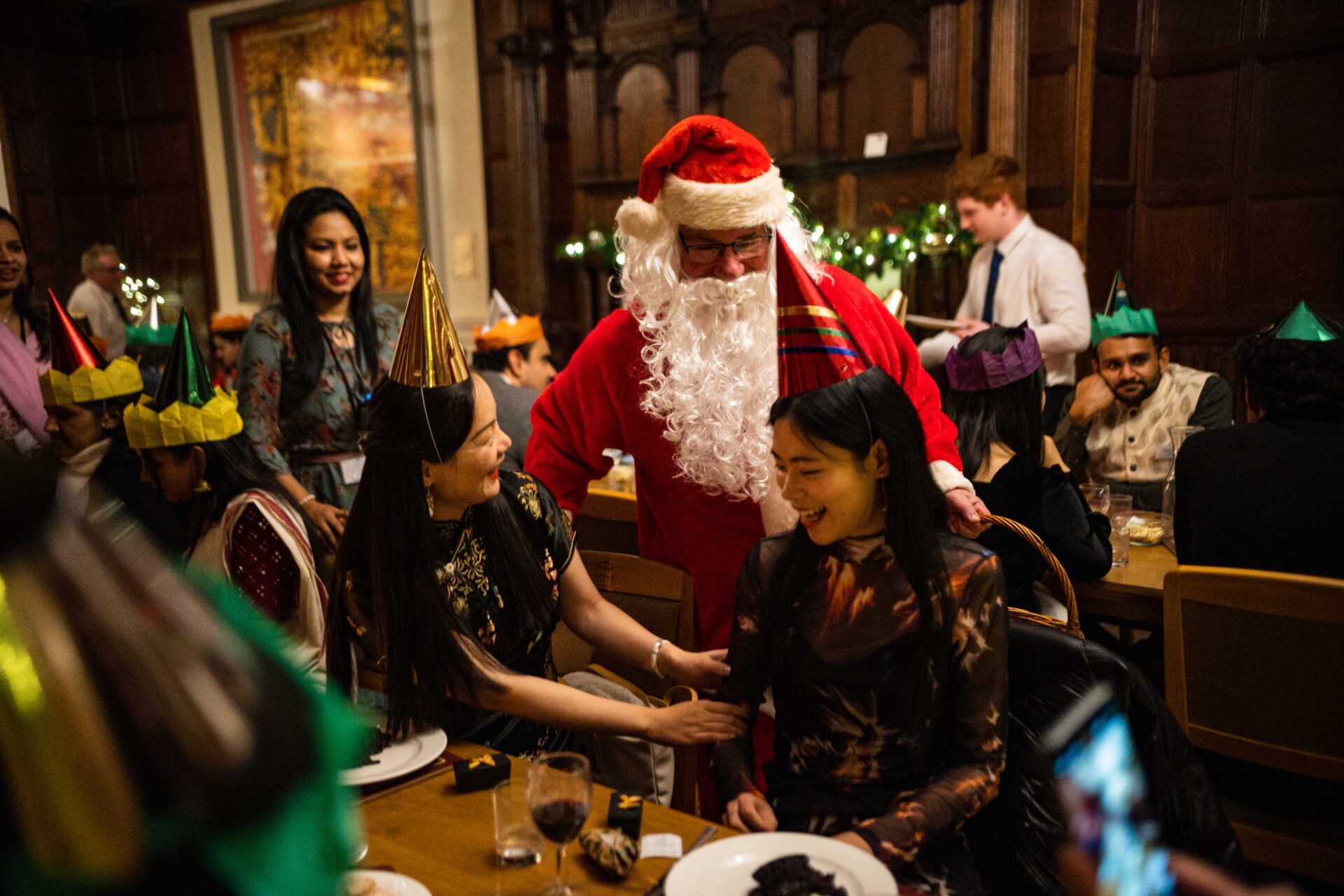 Delegates meeting Father Christmas at the Cumberland Lodge Christmas Conference 2022.