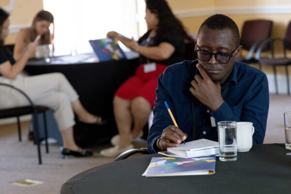 Cumberland Lodge Fellow Sam Wairimu takes notes for his future resources.