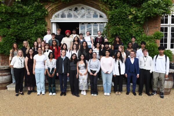 Students stand for a group photo outside Cumberland Lodge at the Magna Carta event.