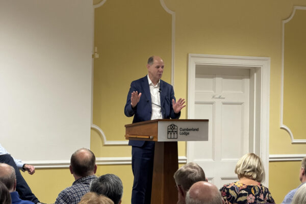 An Image of Sire Philip Barton speaking at Cumberland Lodge
